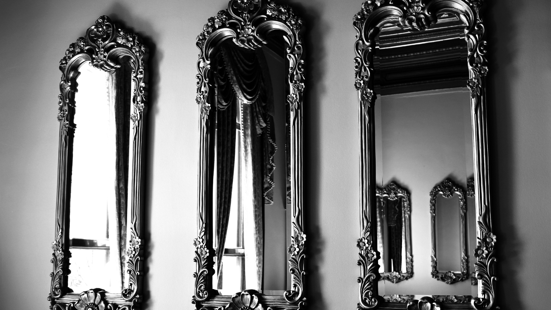 Three Mirrors hanging on a wall