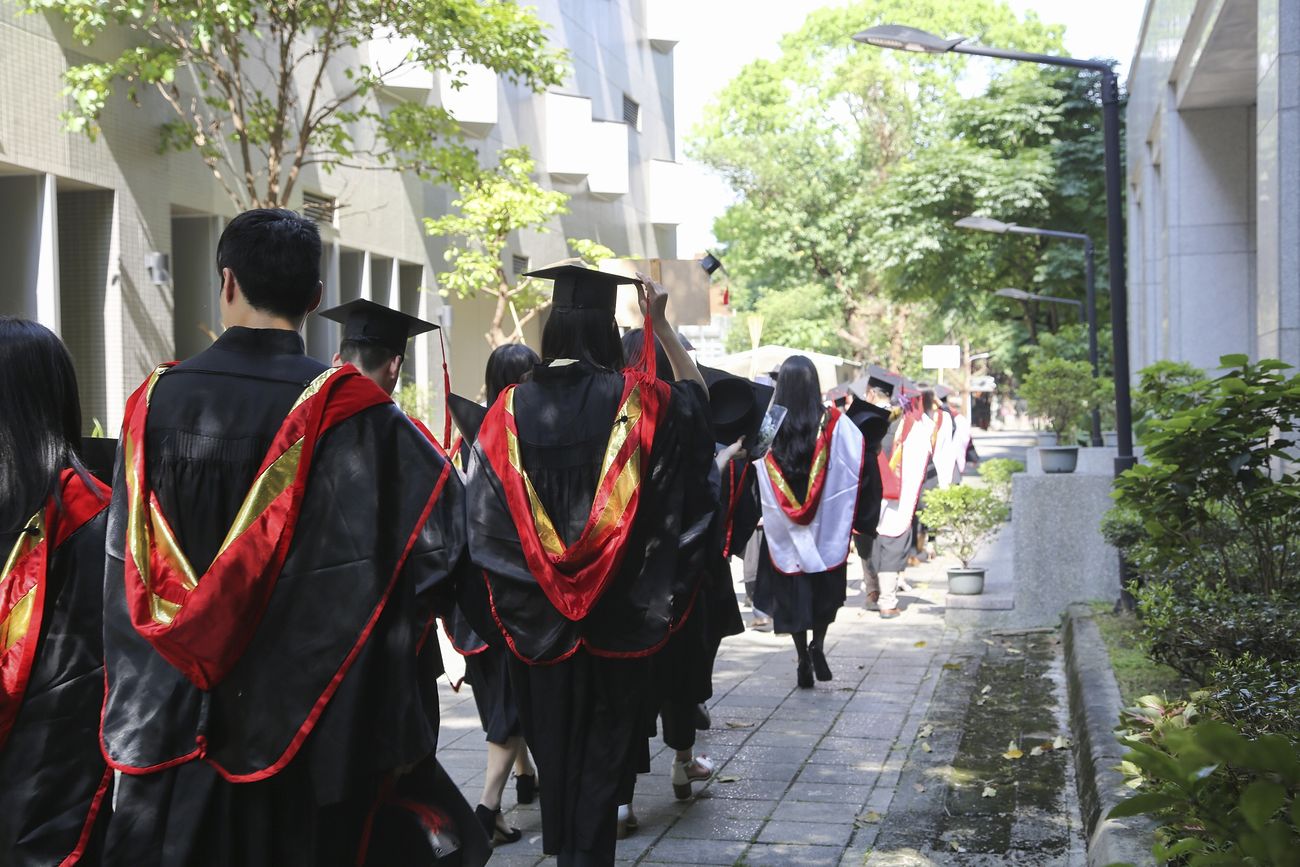 Graduating students in mortarboards