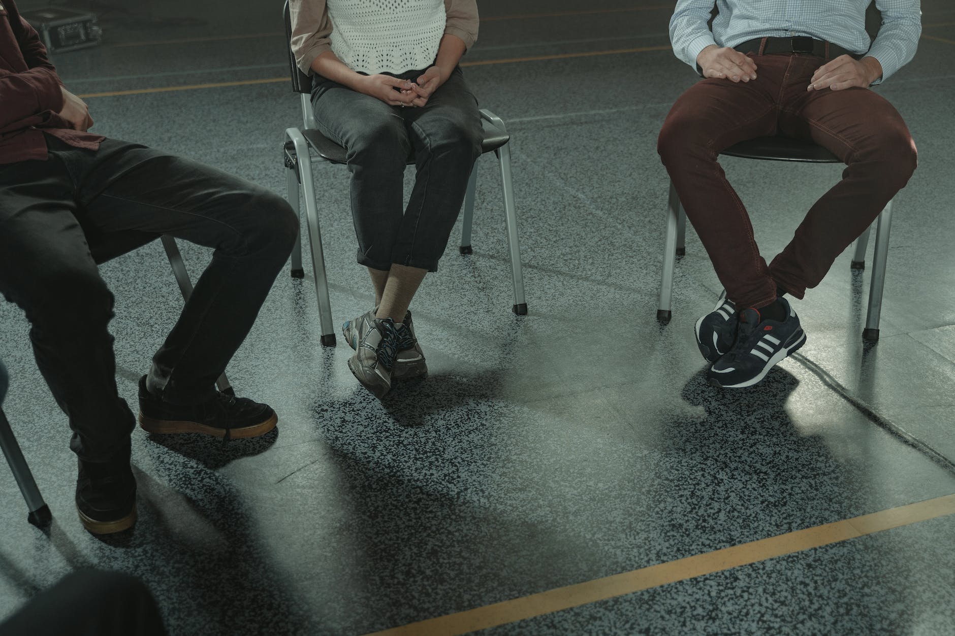 people sitting on chairs in close up photography