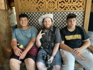 Robby sitting with some students at the Louisville Zoo